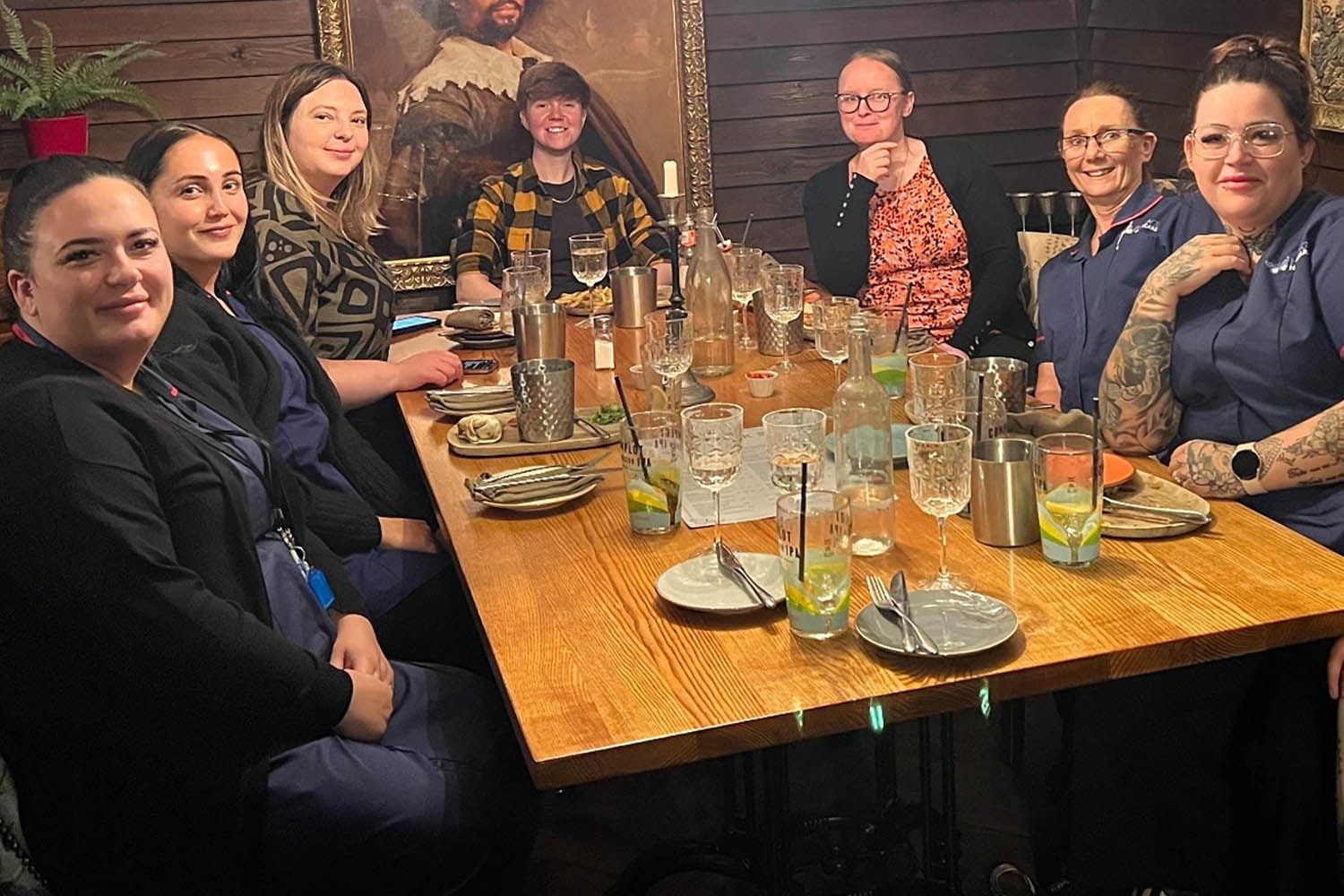 Heritage Healthcare Wakefield's carers sat around a table for a team meal.