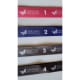 ID Badge lanyards with the Heritage Healthcare butterfly logo and numbers denoting years service. Top to bottom: Pink, Purple, Grey, Black