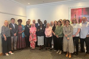 On the left is Director, Michelle, to the right of her is Song, the Managing Director of Heritage Healthcare Epsom. To the right of him is Janet, the Operations Manager & Nominated Individual of Heritage Healthcare Wandsworth, to the right of her is Tarek, the Director & Registered Care Manager of Heritage Healthcare Cheadle. Stood next to him is Tammanna, the Director & Operations Manager of Heritage Healthcare Cheadle. Stood behind them is Marketing Assistant Joel and CEO Glenn. Stood to the right of them is Melody and Sackson, Melody is the Marketing lead of Heritage Healthcare Wandsworth whilst Sackson is the Director of Heritage Healthcare Wandsworth. Stood to the right of them is Heritage Healthcare’s Marketing Manager, Jane, as well as the Franchise Support Manager, Yvette. Stood next to them is Suzanne and Tanya the Directors & Registered Care Managers of Heritage Healthcare North Tyneside. To the right of them is Deepti and Subhadra. Deepti is the Director & Nominated Individual of Heritage Healthcare Leicester and Subhadra is a Director of Heritage Healthcare Leicester. Stood behind them is Director Amanda as well as Finance Manager, Lisa. Finally, on the right is Franchise Development Manager, John.